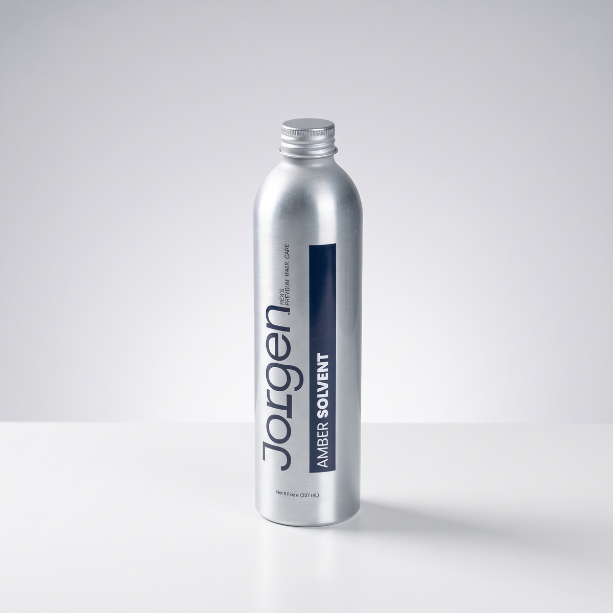 Jorgen Amber Super Solvent adhesive remover in a silver aluminum bottle