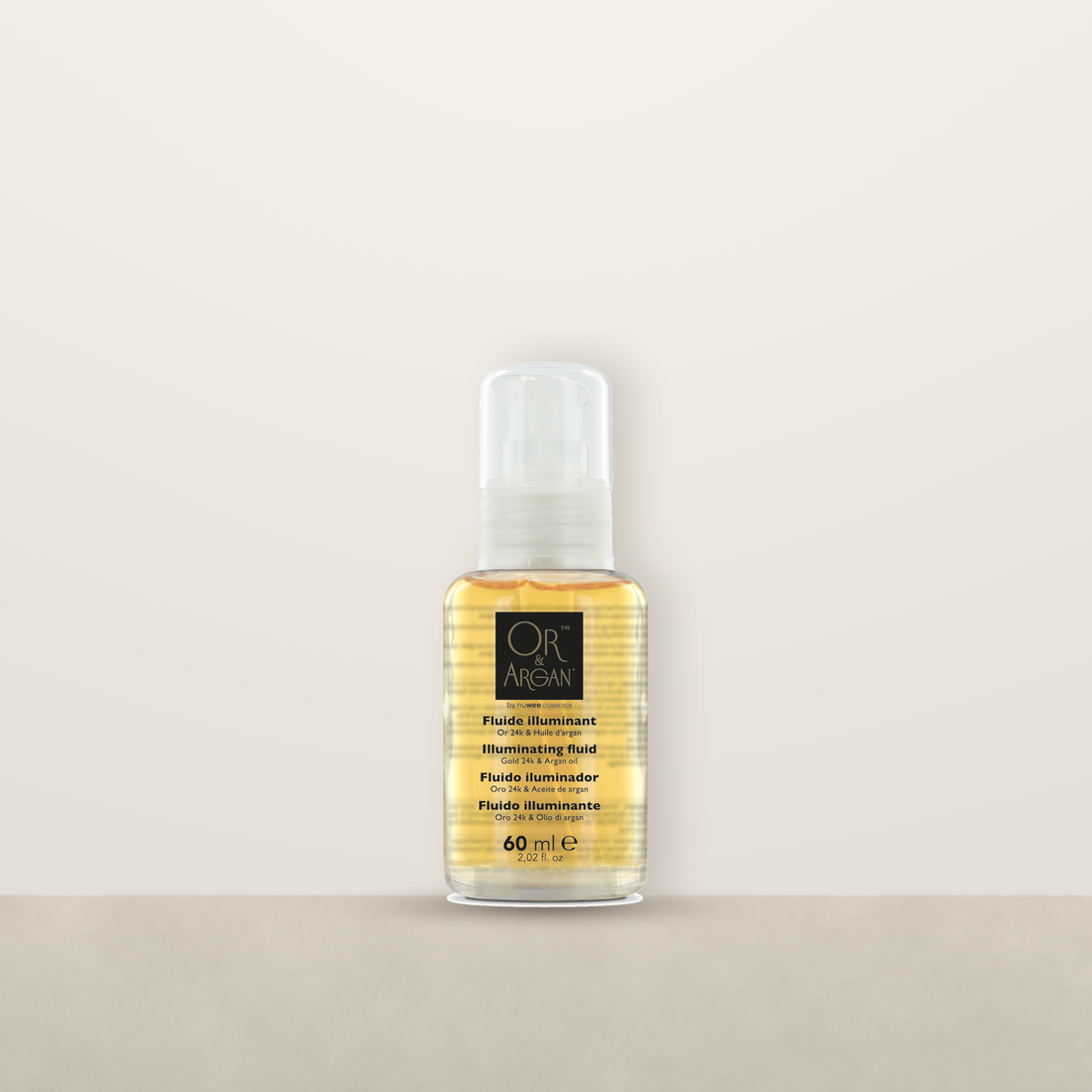 OR &amp; Argan Fluide Illuminant pump bottle on a stone ledge