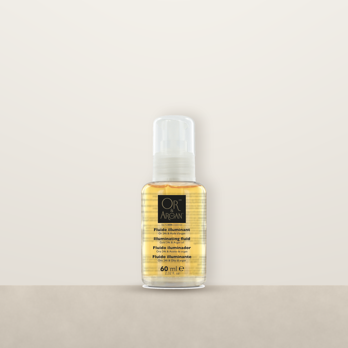 OR &amp; Argan Fluide Illuminant pump bottle on a stone ledge
